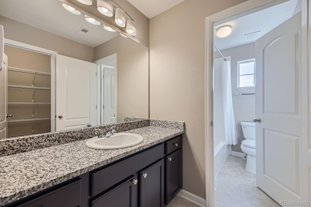 3423 Princeton Pl, Broomfield, CO 80023 - bathroom featuring toilet, vanity, baseboards, shower / bath combo with shower curtain, and tile patterned flooring