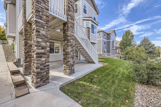 view of community featuring a yard and a patio