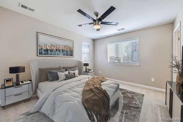 carpeted bedroom with ceiling fan