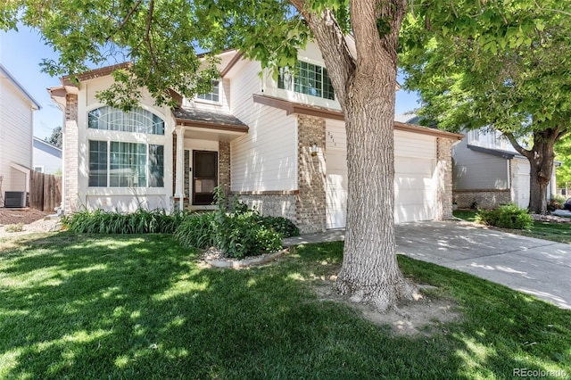 2211 S Moline Ct, Aurora, CO 80014 - view of front of home with brick siding, concrete driveway, and an attached garage
