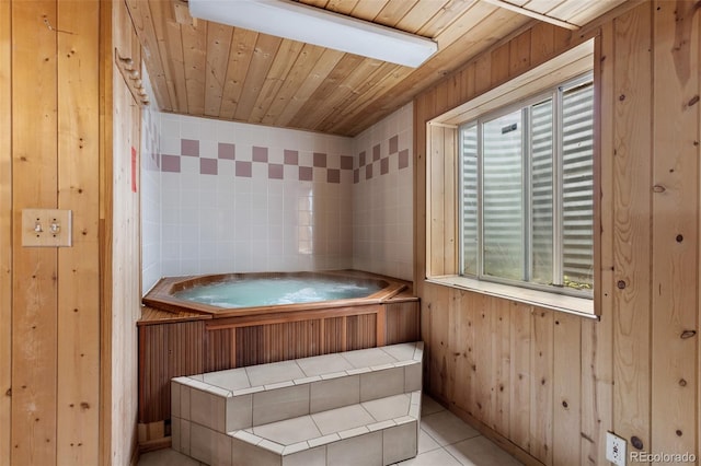 2211 S Moline Ct, Aurora, CO 80014 - bathroom with wooden walls, tile patterned floors, a tub, and wood ceiling