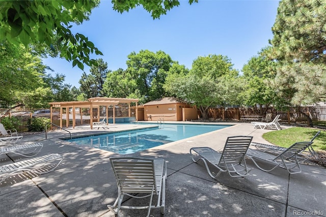 2211 S Moline Ct, Aurora, CO 80014 - community pool featuring a pergola and a patio area