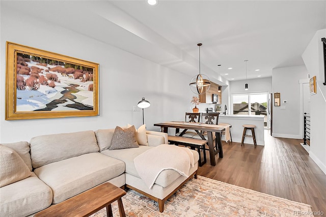 3458 W 63rd Ave, Denver, CO 80221 - living room with recessed lighting, wood finished floors, and a chandelier