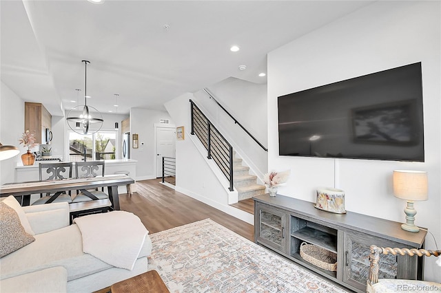 3458 W 63rd Ave, Denver, CO 80221 - living area with wood finished floors, stairs, and recessed lighting