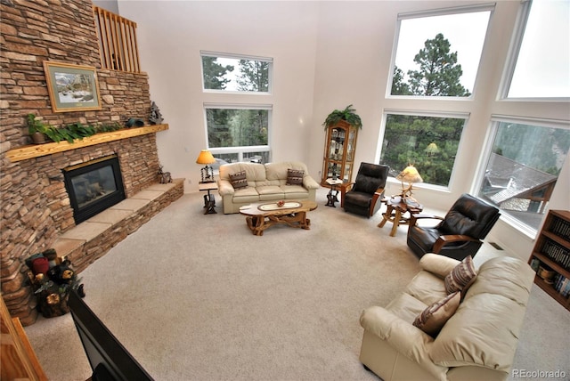 319 Summit Rd, Woodland Park, CO 80863 - carpeted living room with a towering ceiling and a stone fireplace