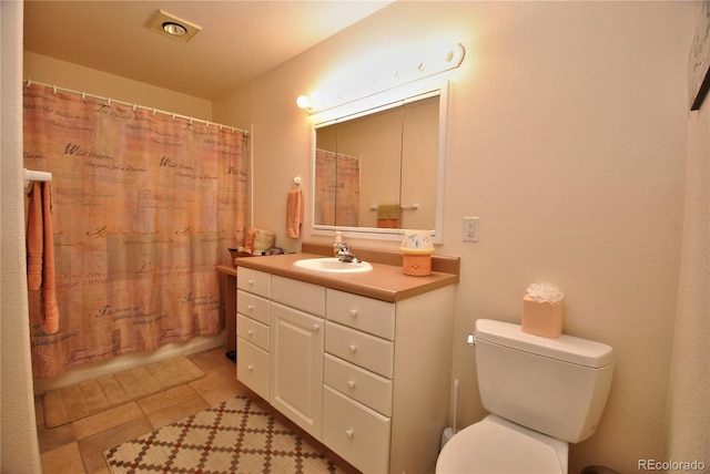 319 Summit Rd, Woodland Park, CO 80863 - bathroom featuring toilet, vanity, and tile patterned floors