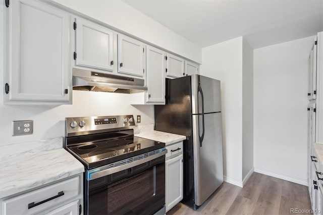 3141 S Tamarac Dr Unit 206E, Denver, CO 80231 - kitchen featuring stainless steel appliances, under cabinet range hood, light wood finished floors, and light stone countertops
