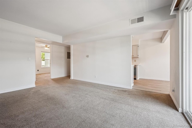 3141 S Tamarac Dr Unit 206E, Denver, CO 80231 - unfurnished room featuring light carpet and ceiling fan
