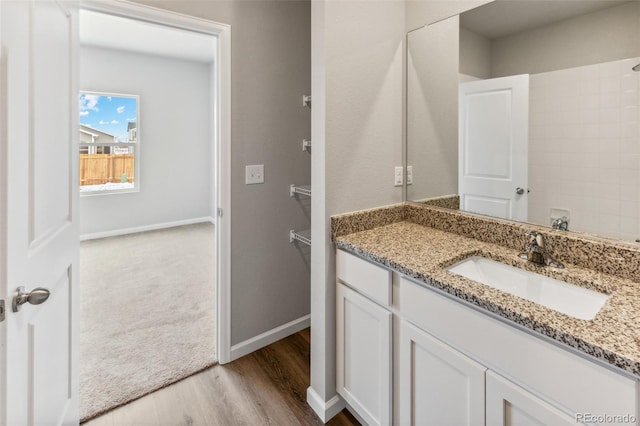 bathroom featuring vanity and wood-type flooring