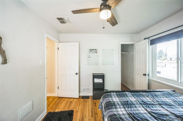 3241 Sheridan Blvd, Wheat Ridge, CO 80212 - bedroom featuring light wood-style floors, a closet, ceiling fan, and baseboards