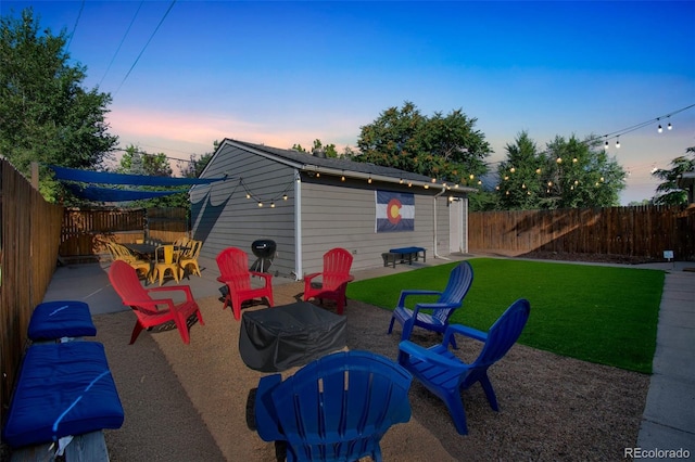 3241 Sheridan Blvd, Wheat Ridge, CO 80212 - patio terrace at dusk featuring outdoor dining space and a patio