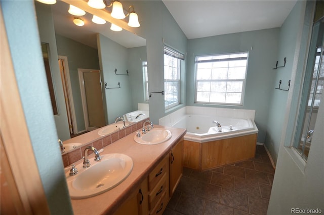 full bath featuring vaulted ceiling and a sink