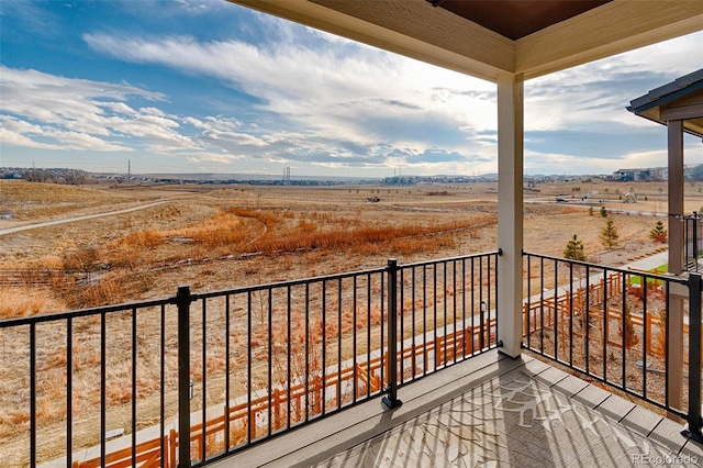 balcony featuring a rural view