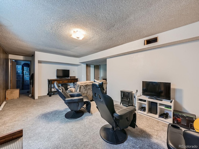 carpeted living area with a textured ceiling