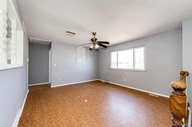 spare room featuring ceiling fan and hardwood / wood-style flooring