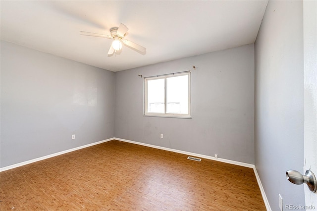 unfurnished room featuring hardwood / wood-style floors and ceiling fan