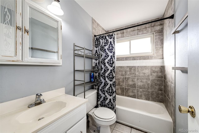 full bathroom featuring tile patterned floors, vanity, toilet, and shower / bath combo with shower curtain