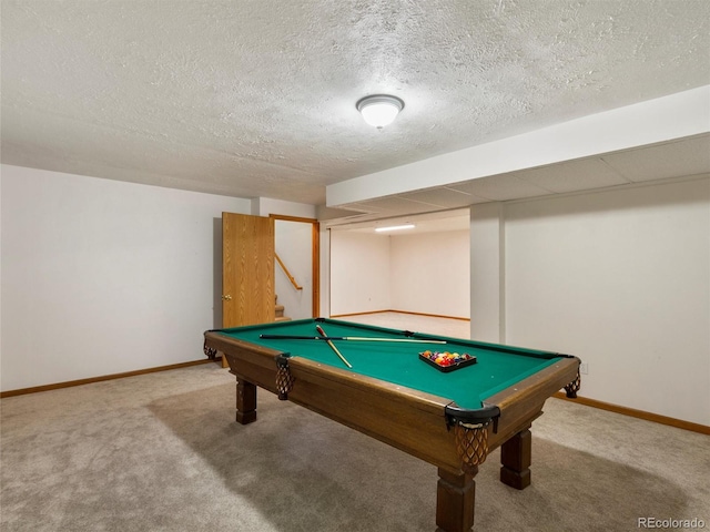 rec room featuring carpet, a textured ceiling, and pool table