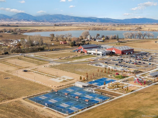 drone / aerial view with a water and mountain view