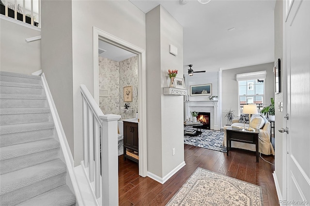 interior space featuring hardwood / wood-style flooring and ceiling fan