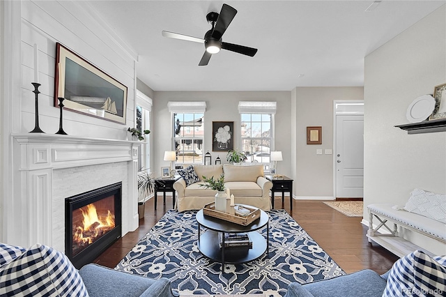 living room featuring dark hardwood / wood-style floors and ceiling fan