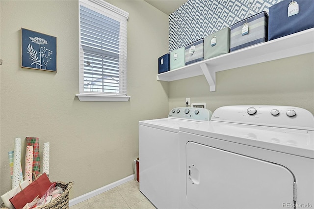 laundry room featuring light tile patterned floors and independent washer and dryer