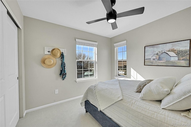 bedroom featuring carpet floors, ceiling fan, and a closet