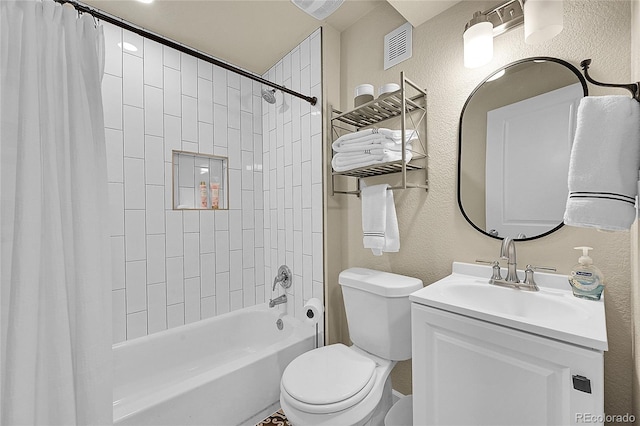 full bathroom featuring shower / tub combo with curtain, vanity, and toilet