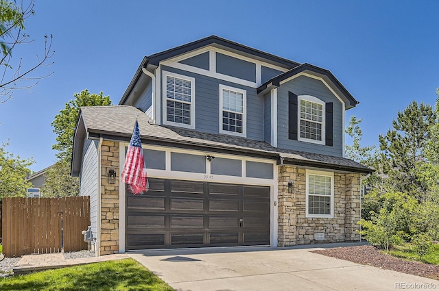 9545 Grand Cypress Cv, Lone Tree, CO 80124 - view of front of house with stone siding, driveway, and a garage
