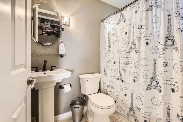9545 Grand Cypress Cv, Lone Tree, CO 80124 - full bath with toilet, a shower with curtain, tile patterned flooring, and a textured wall