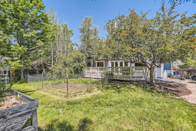 9545 Grand Cypress Cv, Lone Tree, CO 80124 - view of yard featuring a garden and a wooden deck