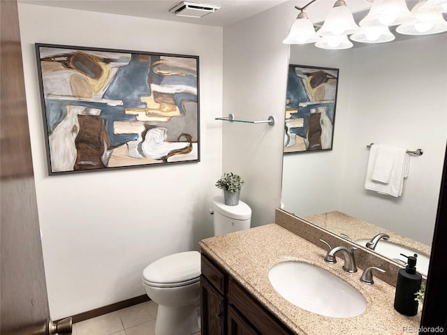 bathroom featuring toilet, tile patterned flooring, vanity, and a notable chandelier