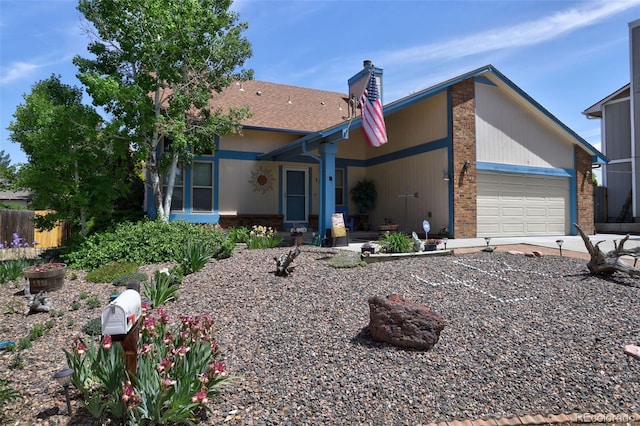 back of property with a garage