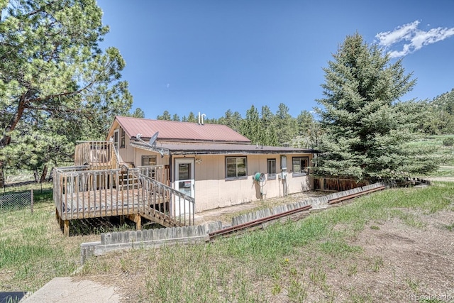 6130 County Road 328, Westcliffe, CO 81252 - rear view of house featuring a wooden deck and a metal roof