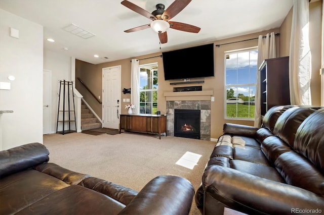 12744 Leyden St Unit F, Thornton, CO 80602 - living room with light colored carpet, a ceiling fan, stairway, a fireplace, and recessed lighting