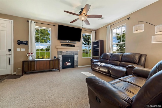 12744 Leyden St Unit F, Thornton, CO 80602 - living area featuring plenty of natural light, a ceiling fan, light carpet, and a high end fireplace