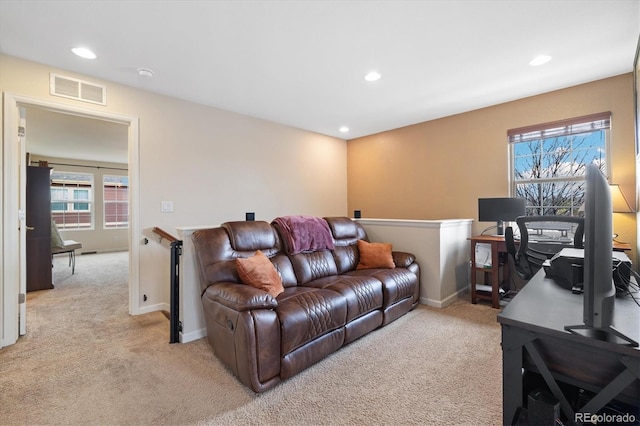 12744 Leyden St Unit F, Thornton, CO 80602 - living room featuring light colored carpet, recessed lighting, and an office area