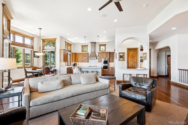 6194 Falcon Ridge Way, Morrison, CO 80465 - living area featuring a ceiling fan, baseboards, recessed lighting, wood finished floors, and arched walkways