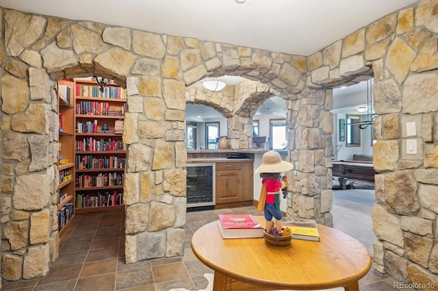 6194 Falcon Ridge Way, Morrison, CO 80465 - wine area with wine cooler and arched walkways