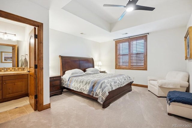 6194 Falcon Ridge Way, Morrison, CO 80465 - bedroom with a sink, light carpet, baseboards, and connected bathroom