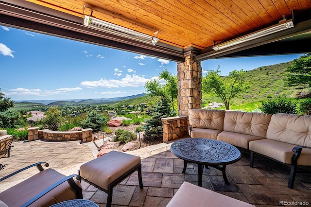 6194 Falcon Ridge Way, Morrison, CO 80465 - view of patio with outdoor lounge area and a mountain view