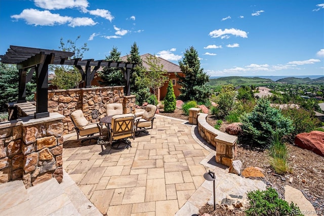 6194 Falcon Ridge Way, Morrison, CO 80465 - view of patio featuring a pergola and a mountain view