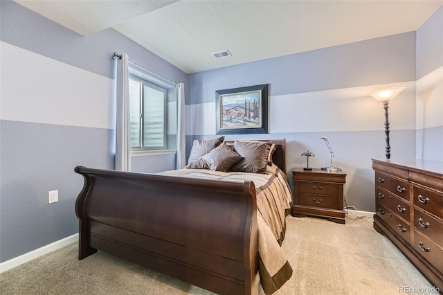 bedroom with light colored carpet