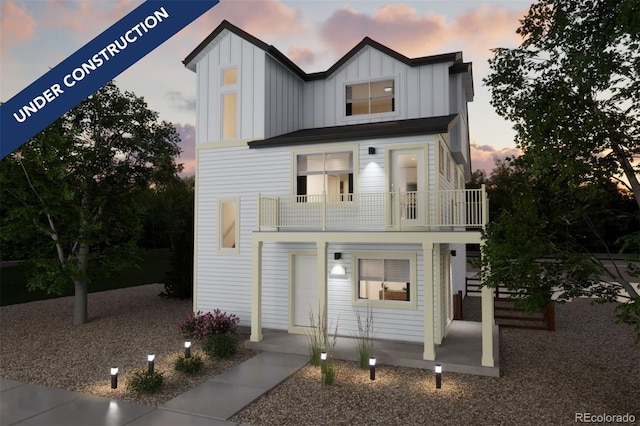 13588 E 103rd Pl, Commerce City, CO 80022 - view of front of house with a balcony and board and batten siding