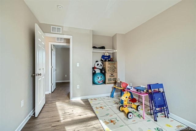 playroom featuring hardwood / wood-style flooring