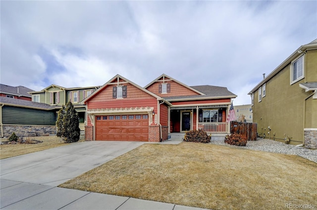 craftsman house featuring covered porch, concrete driveway, a front yard, an attached garage, and brick siding