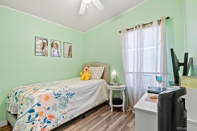 bedroom featuring ceiling fan and hardwood / wood-style flooring