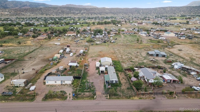 birds eye view of property with a mountain view