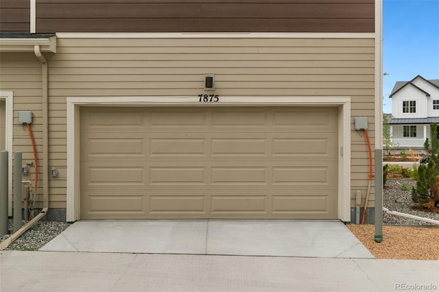 garage featuring driveway