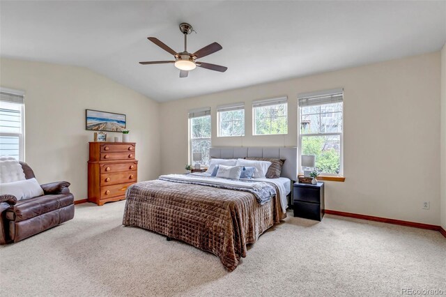 carpeted bedroom with a ceiling fan, baseboards, and lofted ceiling